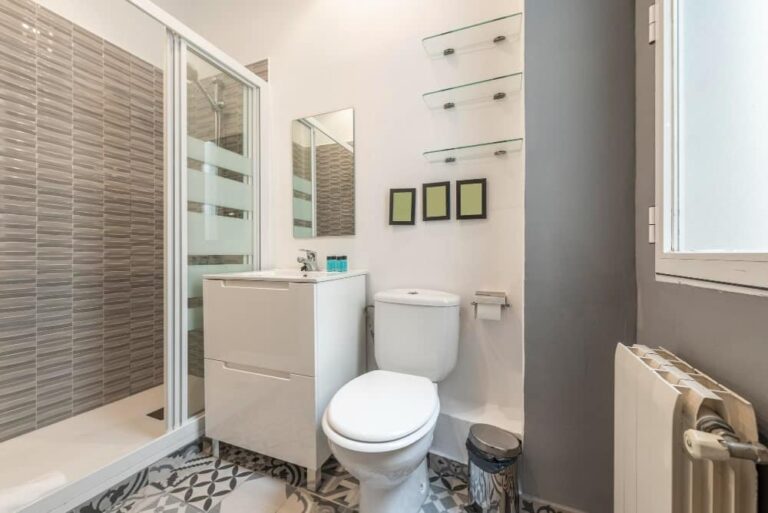 Bathroom With White Resin Sink White Wooden Furniture